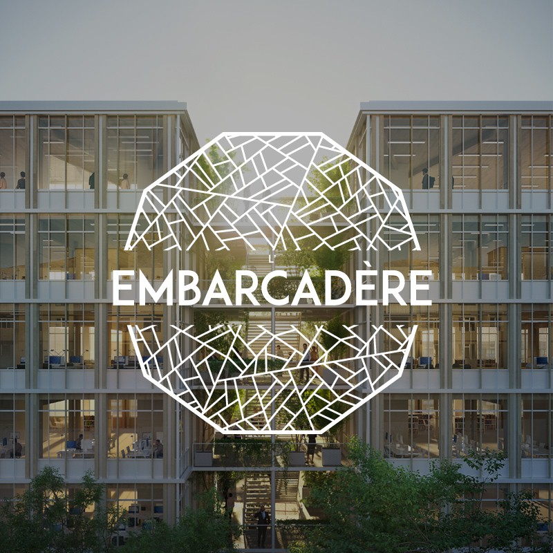 Logo du projet embarcadère sur fond avec des immeubles